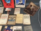 several books are on a table with a black table cloth