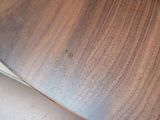 a close up of a skateboard on a wooden table
