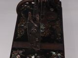 an old sewing machine that is sitting on a table