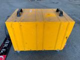 a yellow box sitting on the ground next to a skateboard