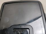 a small television sitting on top of a plastic box