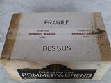 boxes of wine are sitting on a marble counter top