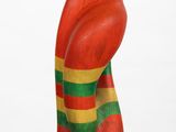 wooden sculpture of a woman ' s head on a white base