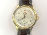 an image of a close up of a wrist watch on a white surface