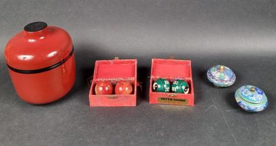 a red box with dice pieces and a red container with dice pieces