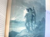 un livre ouvert sur lequel figure l'image d'un homme et d'un ours