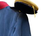 a blue jacket with a hat on top of it