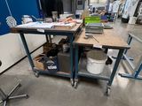 a workbench in the middle of a factory with a lot of tools on it