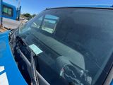 a blue car that is parked next to a blue bus