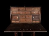 an old wooden dresser with many drawers on it