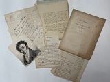 several old letters and papers with a picture of a man in a suit
