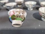 a lot of cups that are sitting on a table