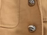 a close up of a jacket with buttons on it