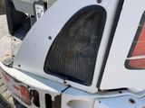 a close up of the front of a white truck
