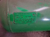 a close up of a green tank with a label on it
