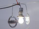 a light that is hanging from a wire with a light bulb attached to it