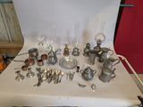 a table with a lot of silverware and silverware on it