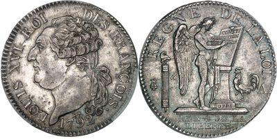 une pièce de monnaie en argent portant l'image d'un homme et d'une femme