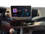 the interior of a car with a touch screen and steering controls