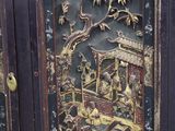 a black cabinet with a painting on the door