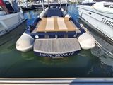 a boat that is sitting in the water next to other boats