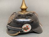 an old helmet with a star on the top of it on a table