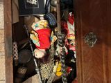 a wooden cabinet with a bunch of items in it