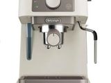 an image of a coffee machine with a cup on top of it