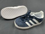 a close up of a pair of blue and white shoes