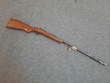 a rifle that is laying on top of a table