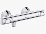 a close up of a chrome shower faucet on a white background