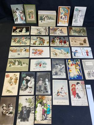 several old postcards of people and children are on a table