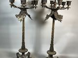 pair of antique brass candelabs with birds on them