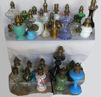 many different types of glass vases on a shelf