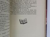 an open book with a drawing of a bookmark on it