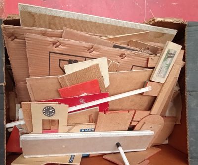 a box full of cardboards and a toothbrush in it