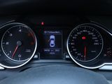 the dashboard of a car with a speedometer, gauges, and a steering wheel