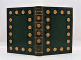 the book is green with gold flowers on the cover
