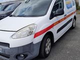 a white van that is parked in a parking lot