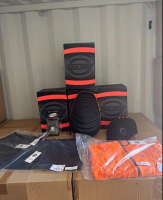 many boxes of orange and black items on a table