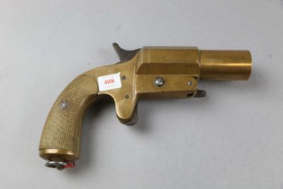 a close up of a gun on a table with a tag on it