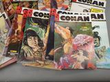 a lot of comic books sitting on a table