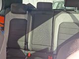 a picture of the back seat of a car with luggage in it
