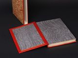 two books that are open on a table