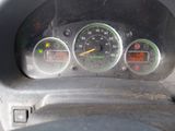 a close up of a car dashboard with a speedometer and gauges