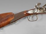 a close up of a rifle on a white background