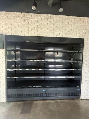 a large empty display case in the middle of a room