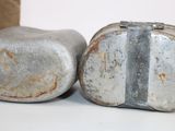 two rocks that are sitting next to each other on a table
