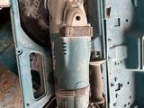 a drill in the case with a cord attached to it
