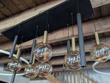 a chandelier that has a lot of glass balls hanging from it